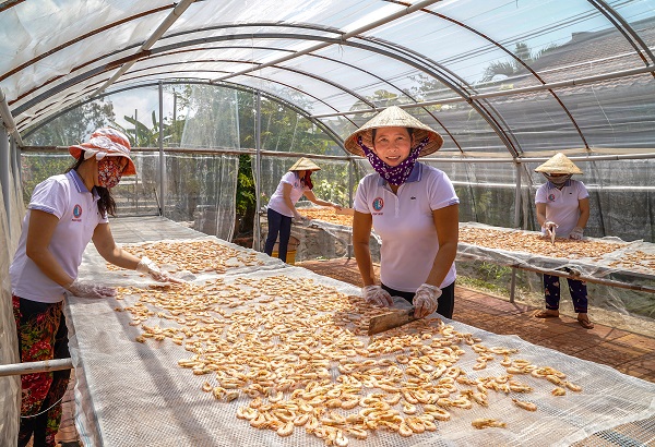 Workers at Ngoc Giau dried seafood processing facility in Ca Mau province